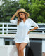 Lightweight beach cover-up with adjustable side drawstrings, convertible sleeves, and flowy silhouette for stylish summer layering