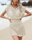 Plus size crochet mesh beach cover-up with buttoned V-neck, short sleeves, and waist-cinching design in lightweight acrylic