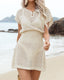 Plus size crochet mesh beach cover-up with buttoned V-neck, short sleeves, and waist-cinching design in lightweight acrylic
