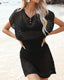Plus size crochet mesh beach cover-up with buttoned V-neck, short sleeves, and waist-cinching design in lightweight acrylic