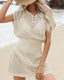 Plus size crochet mesh beach cover-up with buttoned V-neck, short sleeves, and waist-cinching design in lightweight acrylic