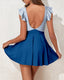 V-neck skirted one-piece swimsuit with ruffle accents, midriff cutout, soft cup bra, and flowy bottom with built-in briefs