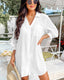 Seersucker mini beach dress with tie cuffs, button front, V-neckline, and ¾ sleeves – perfect for warm-weather layering