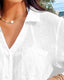 Seersucker mini beach dress with tie cuffs, button front, V-neckline, and ¾ sleeves – perfect for warm-weather layering