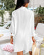 Seersucker mini beach dress with tie cuffs, button front, V-neckline, and ¾ sleeves – perfect for warm-weather layering