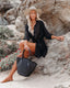 Long sleeve loose-fit beach cover-up with lapel collar and see-through fabric, ideal for swimwear layering and summer versatility