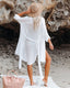 Long sleeve loose-fit beach cover-up with lapel collar and see-through fabric, ideal for swimwear layering and summer versatility