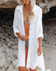 Long sleeve loose-fit beach cover-up with lapel collar and see-through fabric, ideal for swimwear layering and summer versatility