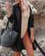 Long sleeve loose-fit beach cover-up with lapel collar and see-through fabric, ideal for swimwear layering and summer versatility