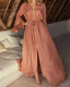Boho maxi beach dress with adjustable waist tie, deep V-neckline, and flowy ankle-length design for elegant summer coverage