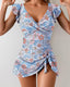 Tummy control swim dress with ruffle sleeves, adjustable straps, built-in shorts, and UPF 50+ protection for feminine sun-safe coverage