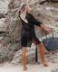 Long sleeve loose-fit beach cover-up with lapel collar and see-through fabric, ideal for swimwear layering and summer versatility